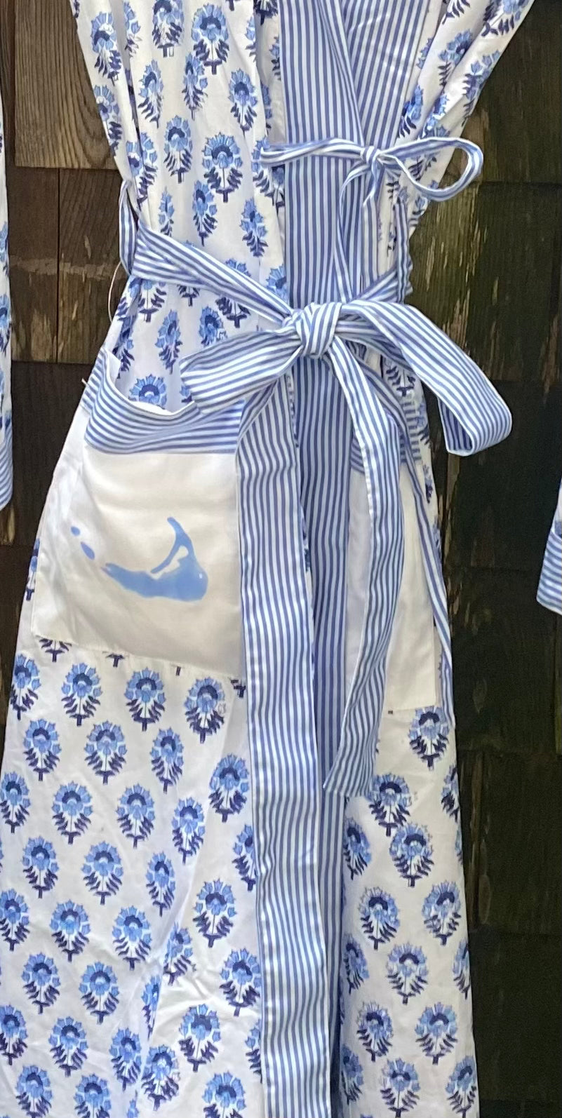 Blue and white flowered robe with light blue map on pocket