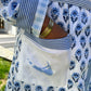 Blue and white flowered robe with light blue map on pocket