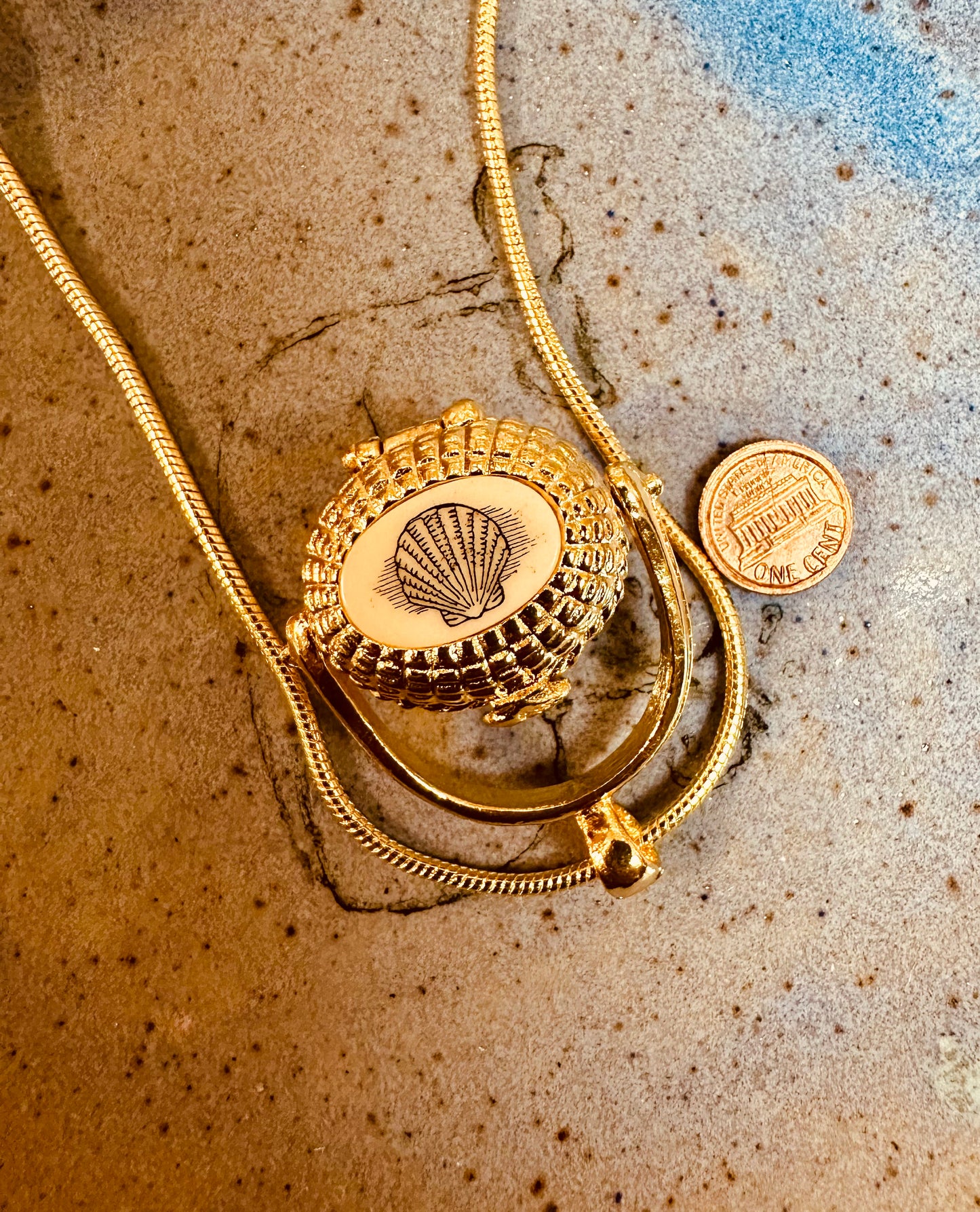 LARGE GOLD PLATED BASKET WITH COIN