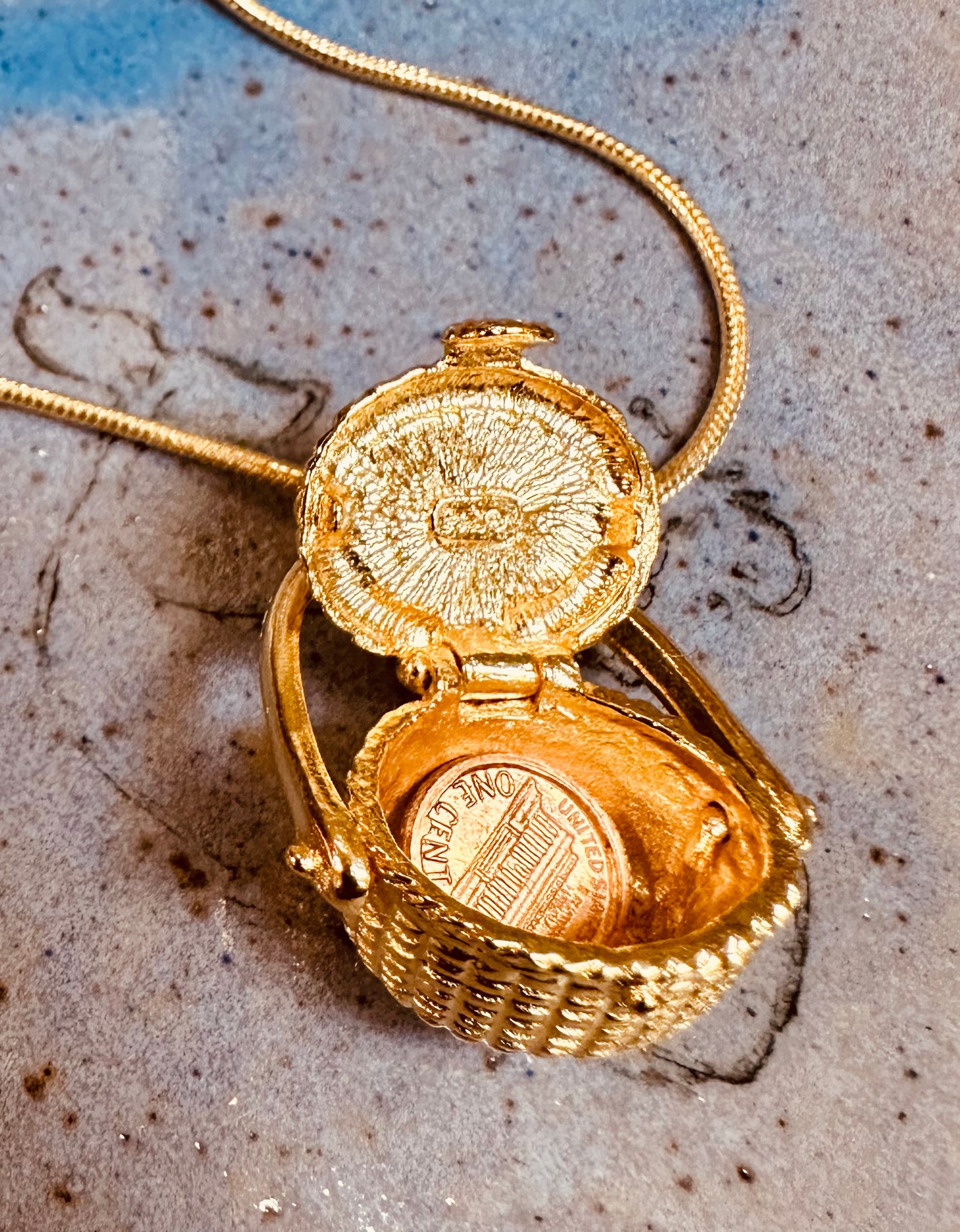 LARGE GOLD PLATED BASKET WITH COIN