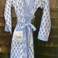 Blue and white flowered robe with light blue map on pocket